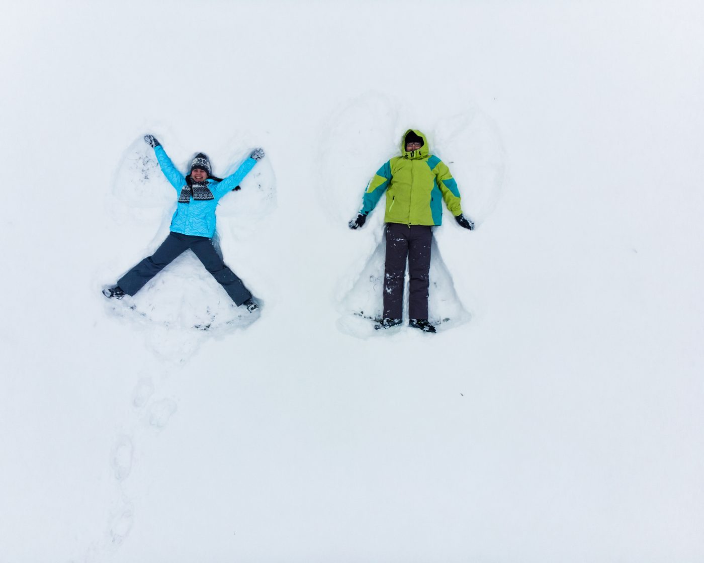 Two participants making snow angels